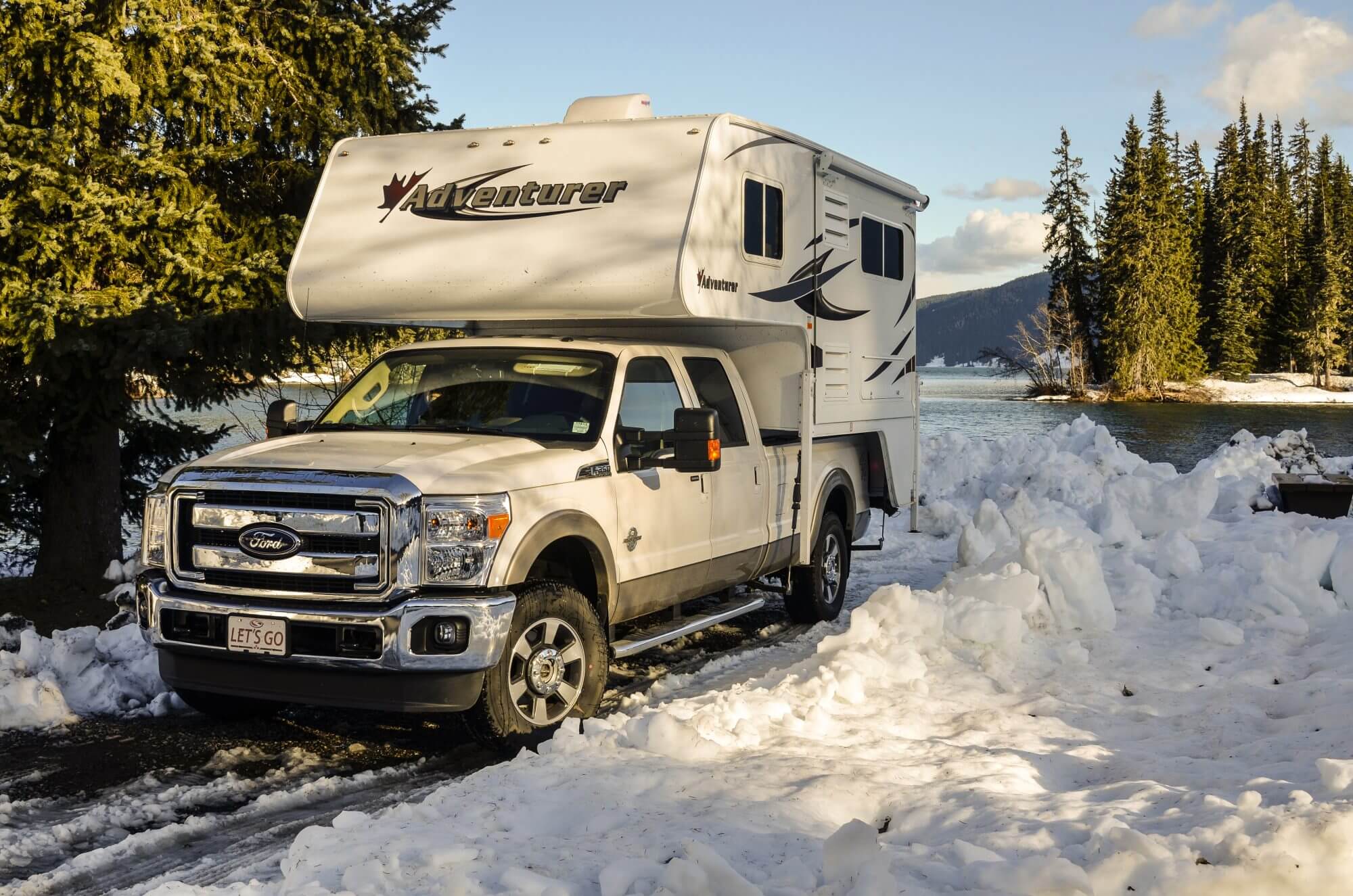 Meziadin Lake Provincial Park, Canada - May 17, 2012: Visitors traveling with RV vehicles enjoy the nature of the Rocky Mountains, Canada, all year round as here in early spring.