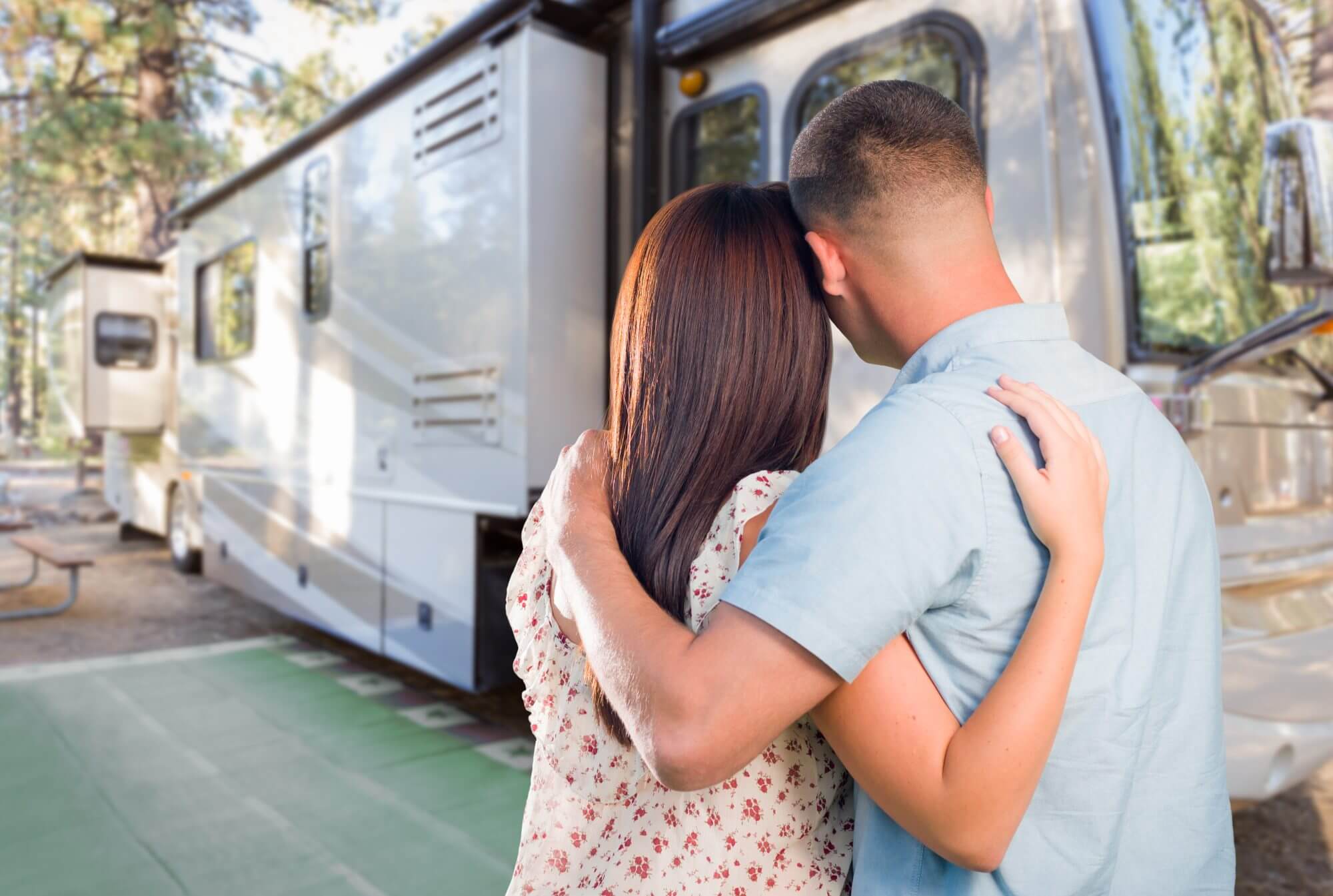 Young Military Couple Looking at New RV.