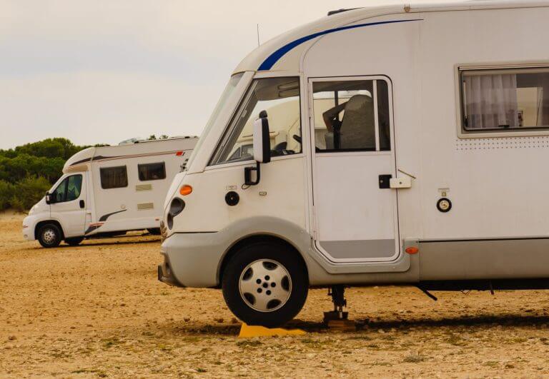 Camper leveling support hydraulic steady leg in use. Caravaning and accessories for motor home.