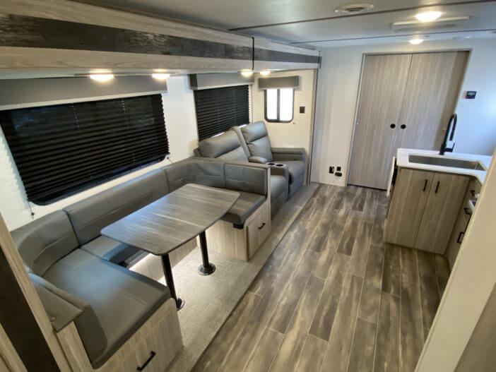 Interior RV photo of living room and kitchen and dinette