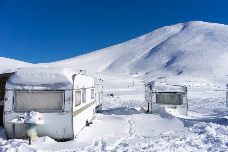 RVs covert in snow at Falakro, in Greece.