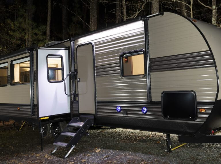 Long trailer at a campsite at Jordan Lake in late autumn