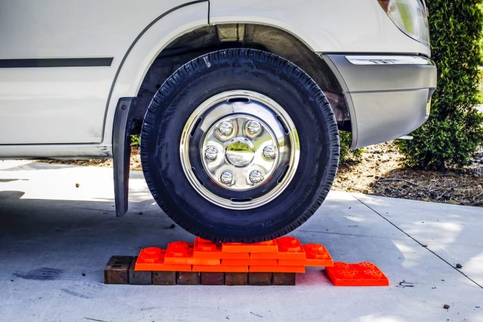 C-Class Motorhome on levelling blocks used to level the vehicle on uneven ground