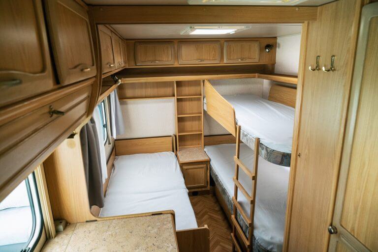 Vacation in camper, caravan. Interrior rooms of Camper caravan car. Holiday on camping in Poland