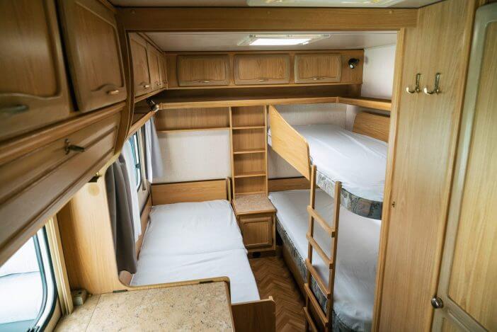 Vacation in camper, caravan. Interrior rooms of Camper caravan car. Holiday on camping in Poland