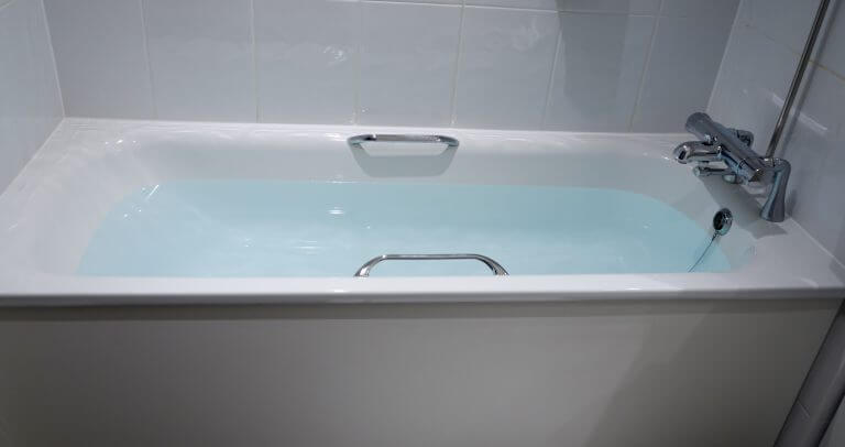 A hotel bath filled with hot water