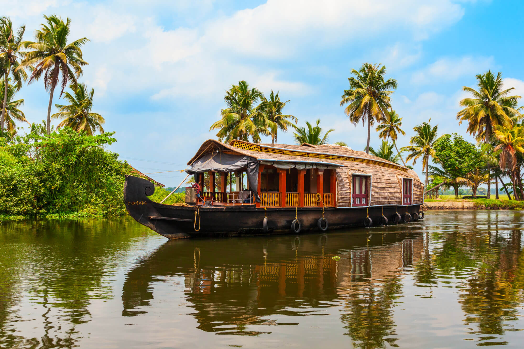 A houseboat sailing in Alappuzha backwaters in Kerala state in India