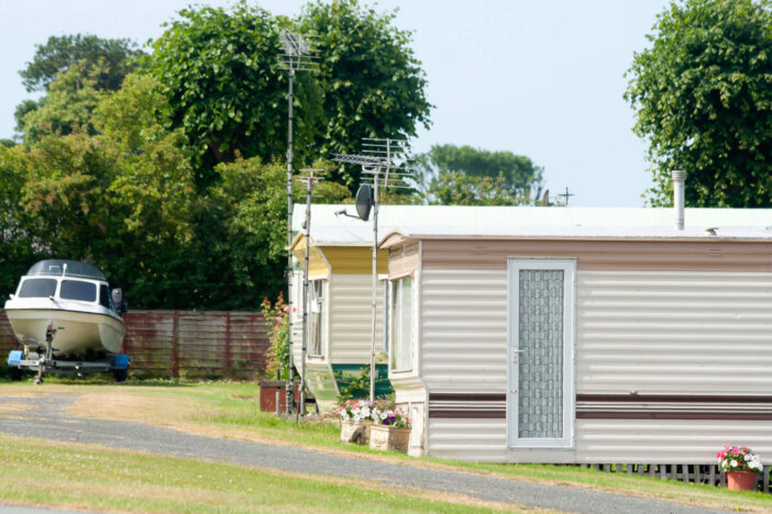 Holiday homes-Chalets in rural wales, withboat parked up ready for the ocean.