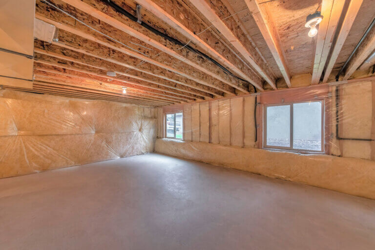 An empty common basement lit with light bulbs