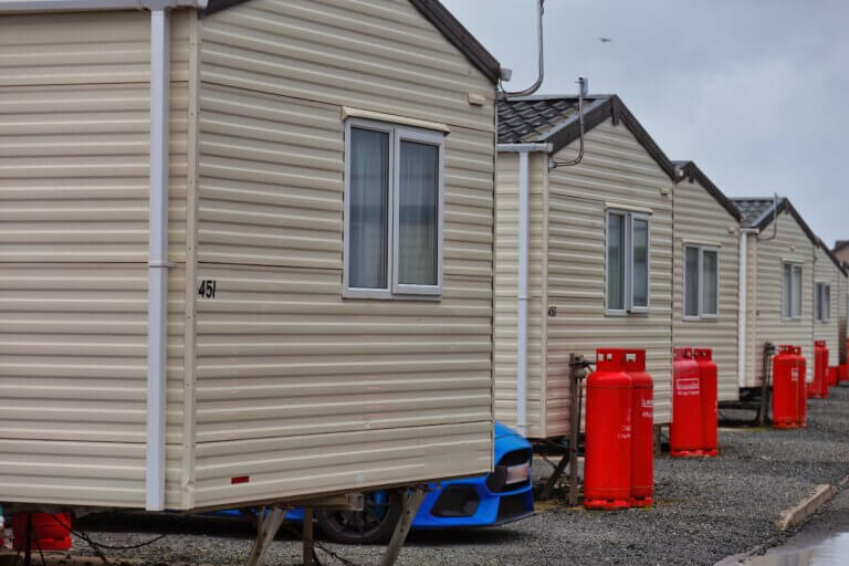 a series of static caravans by the sea in Talybont , great britain