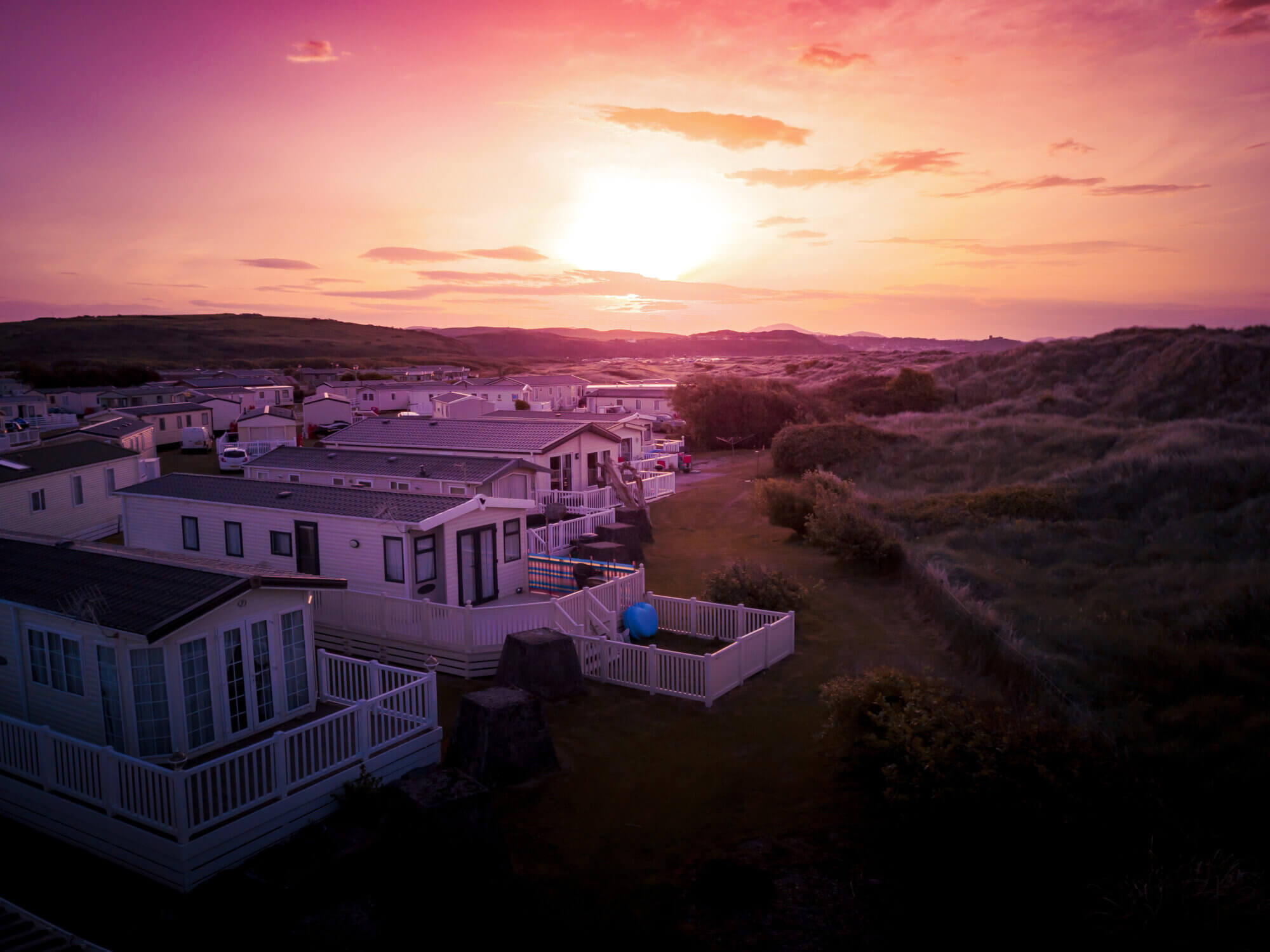 Porthmadog holiday park taken from the air by a drone showing holiday houses and British holiday lifestyle.